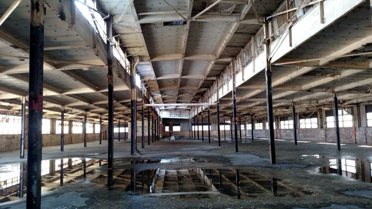 Before — historic factory floor interior, FDP Hotel, Waterloo, Iowa