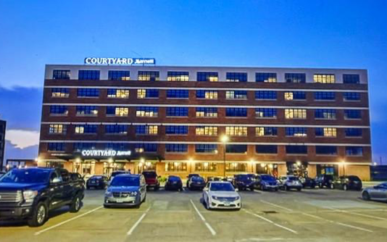 After — Courtyard by Marriott full facade and parking lot at dusk, Waterloo, Iowa